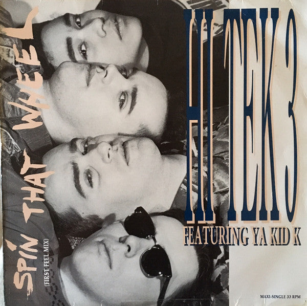 Hi Tek 3 Featuring Ya Kid K – Spin That Wheel (NM, FUNDA EX) BOX7