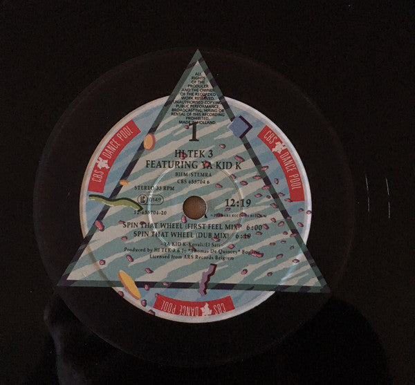 Hi Tek 3 Featuring Ya Kid K – Spin That Wheel (NM, FUNDA EX) BOX7